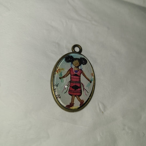 At'ééd with Afro Puffs pendant